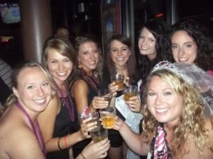 Bachelorette and bridesmaids toasting  at a bachelorette scavenger hunt 