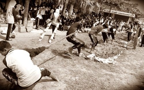 Photo of a tug-o-war game, which is a great team building activity