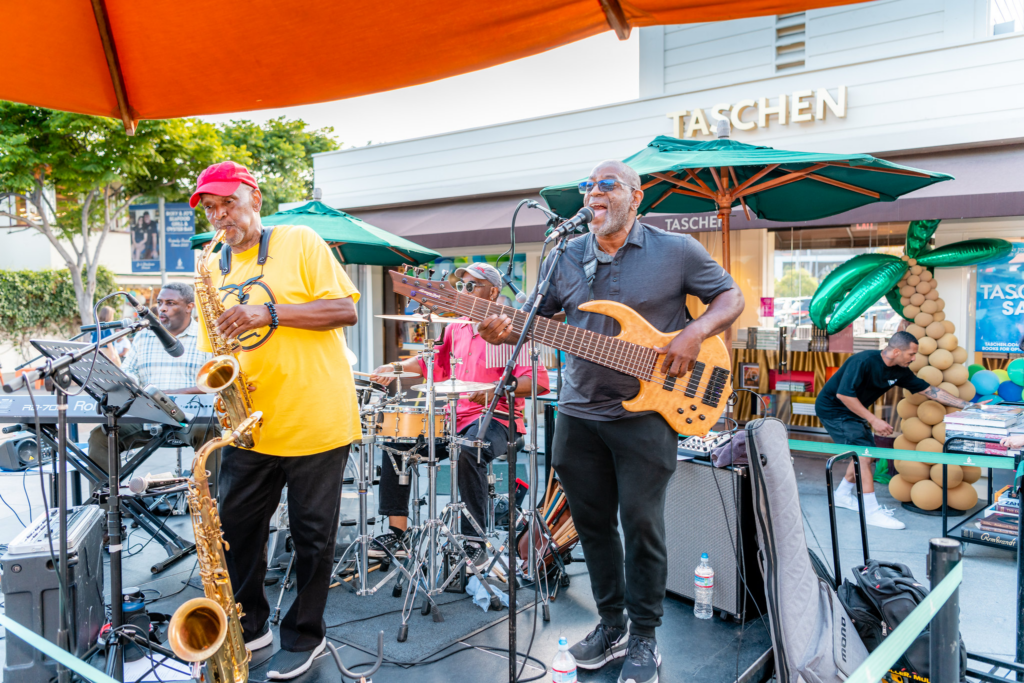 group performing instruments on outdoor stage