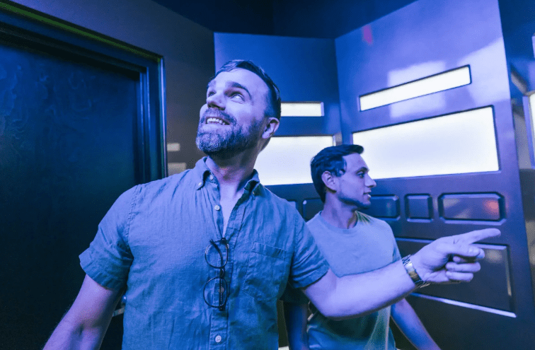 two men in an escape room