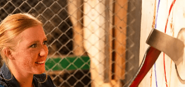 woman with axe at BATL Axe throwing