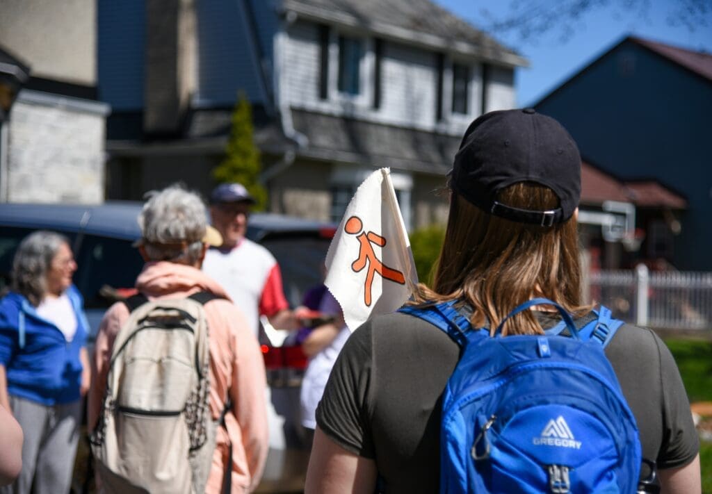people with backpacks on walking tour