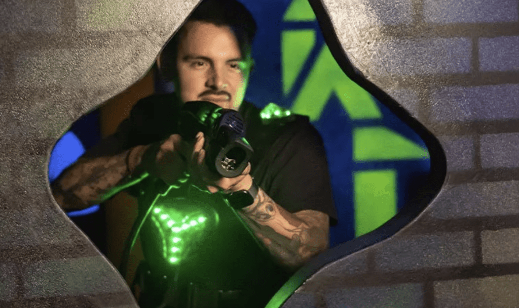 man holding laser tag machine